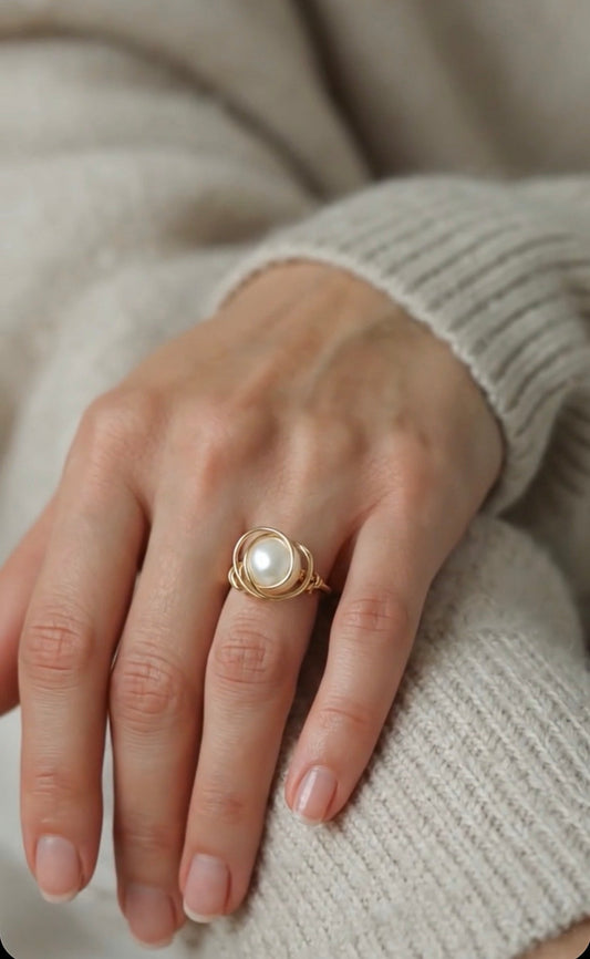 Elegant handmade 14k gold filled ring with a white pearl worn on a model's hand, demonstrating daily jewelry style.